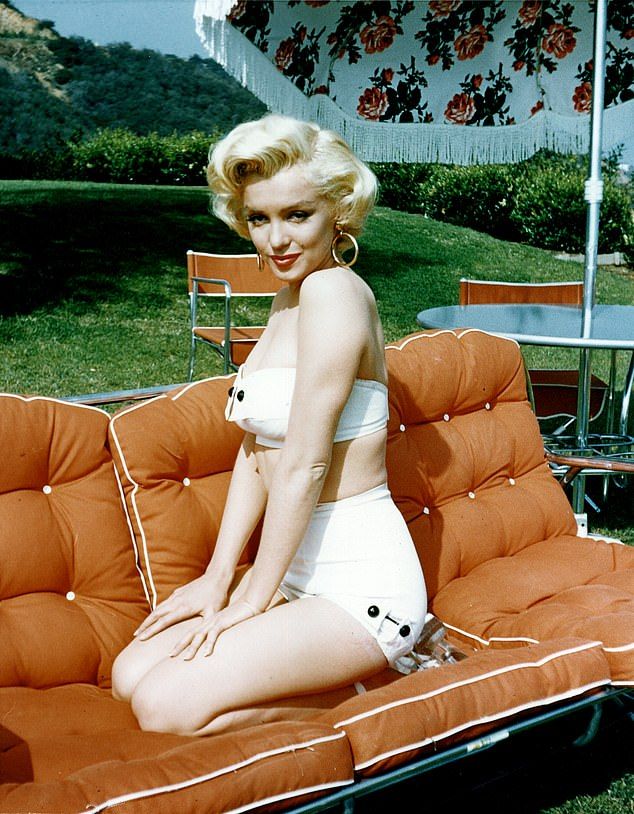 Legend: Monroe pictured posing for a portrait in 1953